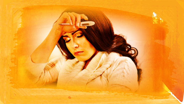 Woman with thermometer, suffering from flu